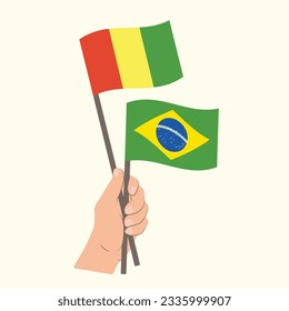 Banderas de Guinea y Brasil, portando banderas