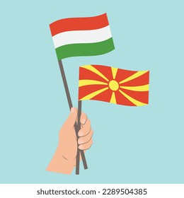 Flags of Hungary and North Macedonia, Hand Holding flags
