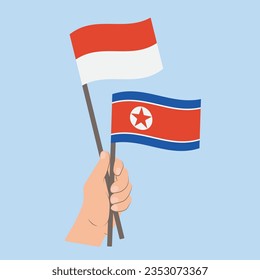 Flags of Indonesia and North Korea, Hand Holding flags