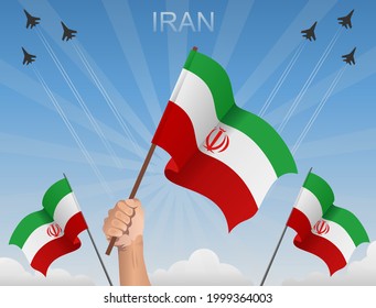 Flags of Iran fluttering under the blue sky