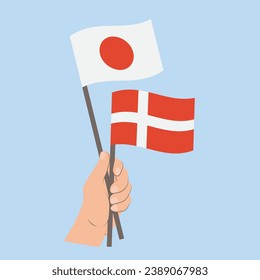 Banderas de Japón y Dinamarca, con banderas de mano