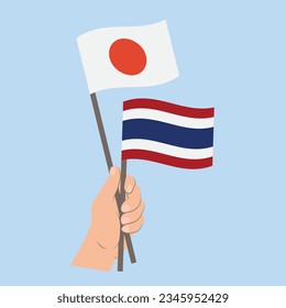 Banderas de Japón y Tailandia, con banderas de mano