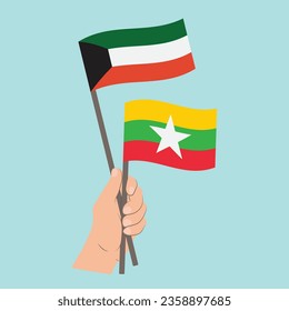 Banderas de Kuwait y Myanmar, con banderas de mano