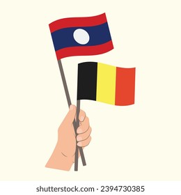 Banderas de Laos y Bélgica, banderas con mano