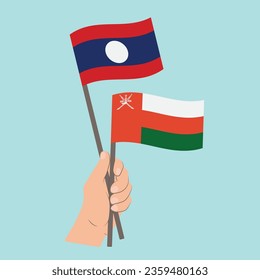 Banderas de Laos y Omán, con banderas de mano