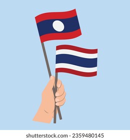 Flags of Laos and Thailand, Hand Holding flags