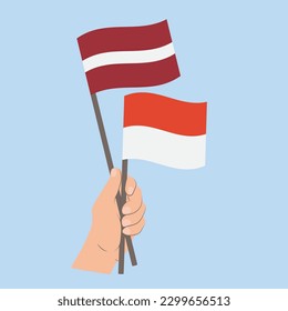 Flaggen von Lettland und Monaco, handgeführte Flaggen