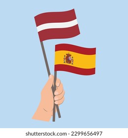 Flags of Latvia and Spain, Hand Holding flags