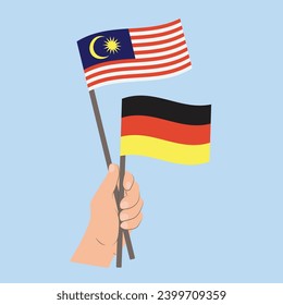 Banderas de Malasia y Alemania, con banderas de mano