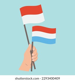 Flags of Monaco and Luxembourg, Hand Holding flags
