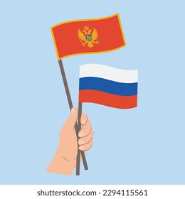 Flags of Montenegro and Russia, Hand Holding flags