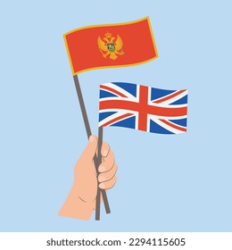 Flags of Montenegro and UK, Hand Holding flags