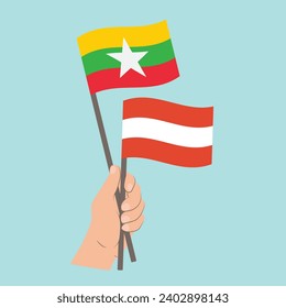 Flaggen von Myanmar und Österreich, handgeführte Flaggen