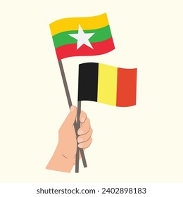 Flags of Myanmar and Belgium, Hand Holding flags