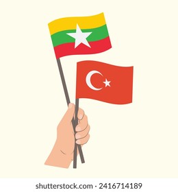 Flaggen von Myanmar und der Türkei, handhabende Flaggen
