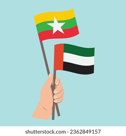 Banderas de Myanmar y los Emiratos Árabes Unidos, portando banderas