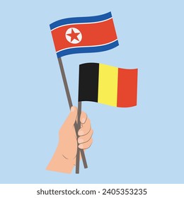 Flags of North Korea and Belgium, Hand Holding flags
