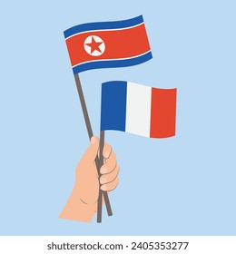 Flags of North Korea and France, Hand Holding flags