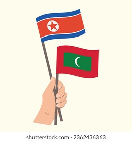 Flags of North Korea and Maldives, Hand Holding flags