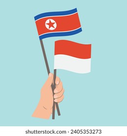 Flaggen von Nordkorea und Monaco, handgeführte Flaggen