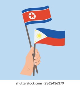 Flags of North Korea and the Philippines, Hand Holding flags