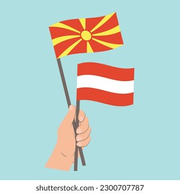 Flags of North Macedonia and Austria, Hand Holding flags