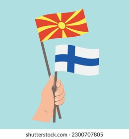 Flags of North Macedonia and Finland, Hand Holding flags