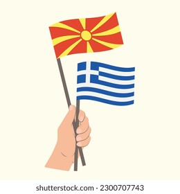 Flags of North Macedonia and Greece, Hand Holding flags