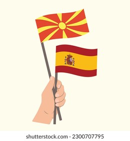 Flags of North Macedonia and Spain, Hand Holding flags