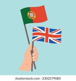 Flags of Portugal and UK, Hand Holding flags
