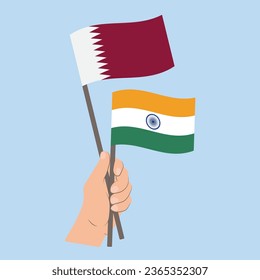 Banderas de Qatar e India, con banderas de mano