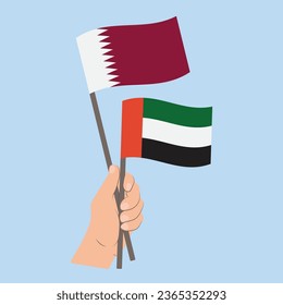 Banderas de Qatar y de los Emiratos Árabes Unidos, portando banderas