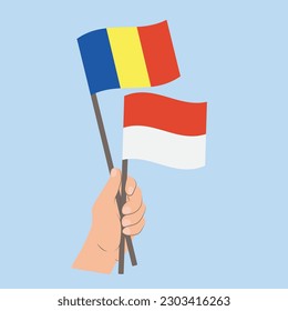 Banderas de Rumania y Mónaco, con banderas de mano