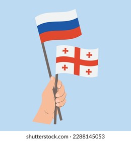 Flags of Russia and Georgia, Hand Holding flags