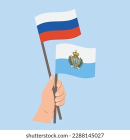 Flags of Russia and San Marino, Hand Holding flags