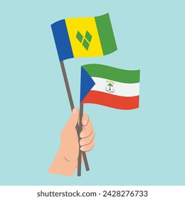 Flags of Saint Vincent and the Grenadines and Equatorial Guinea., Hand Holding flags