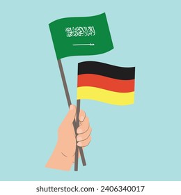 Banderas de Arabia Saudita y Alemania, con banderas de mano