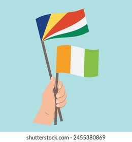 Flags of Seychelles and Côte d'Ivoire, Hand Holding flags