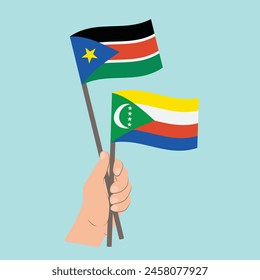 Flags of South Sudan and Comoros, Hand Holding flags