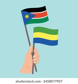 Flags of South Sudan and Gabon, Hand Holding flags