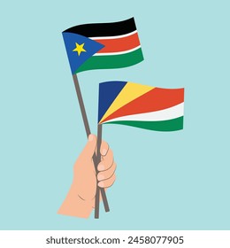 Flags of South Sudan and Seychelles, Hand Holding flags