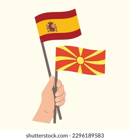 Flags of Spain and North Macedonia, Hand Holding flags