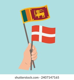 Banderas de Sri Lanka y Dinamarca, con banderas de mano