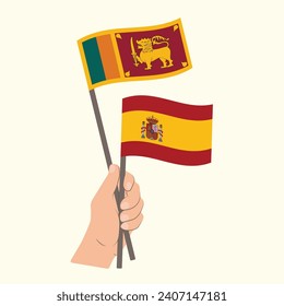 Banderas de Sri Lanka y España, con banderas de mano