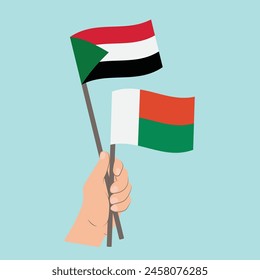 Flags of Sudan and Madagascar, Hand Holding flags