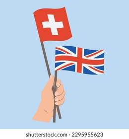Flags of Switzerland and UK, Hand Holding flags