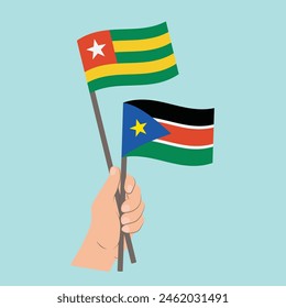 Flags Togo and South Sudan, Hand Holding flags