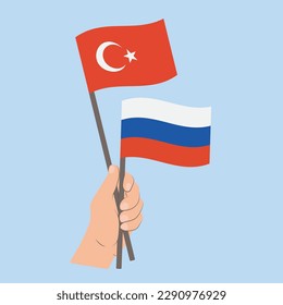 Flags of Turkey and Russia, Hand Holding flags
