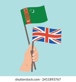 Flags of Turkmenistan and UK, Hand Holding flags