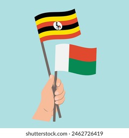 Flags Uganda and Madagascar, Hand Holding flags